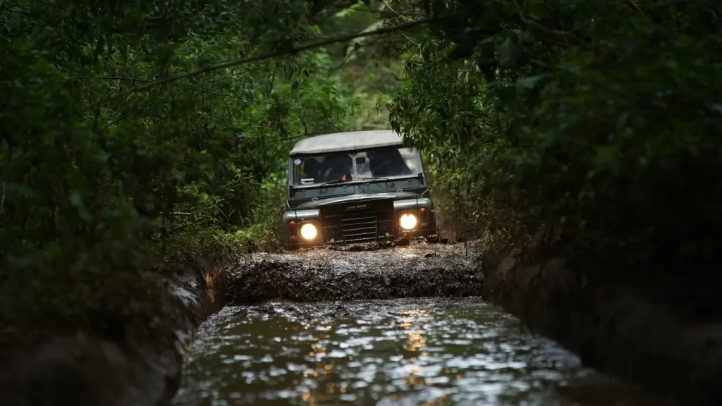 A jeep going off-road in a flooded jungle whilst conducting performance testing on various RVing gear.
