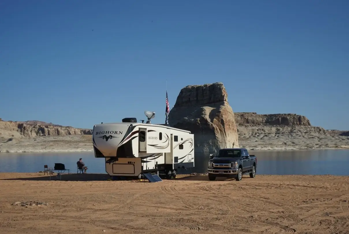 A solo RVer free camping and fishing in an awesome boondocking spot by a desert reservoir.