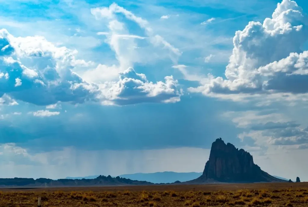 Shiprock, a monadnock in the Navajo Nation of New Mexico, photgraphed against an iconic landscape.