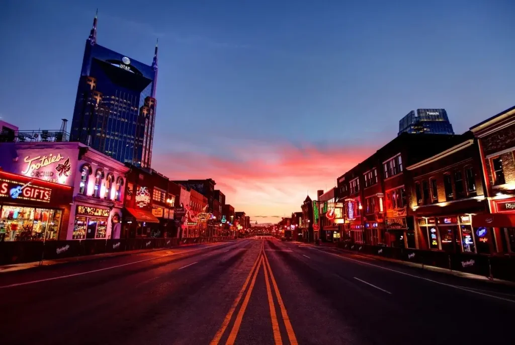 Downtown Nashville, Tennessee, lit up at dusk as the sunset fades.