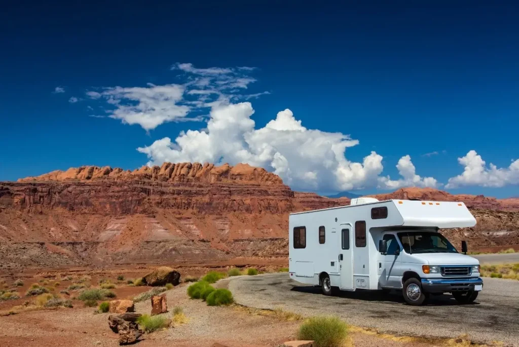 A Class C motorhome covered by the best extended RV warranty available safely boondoicking in the Arizonan wilderness.