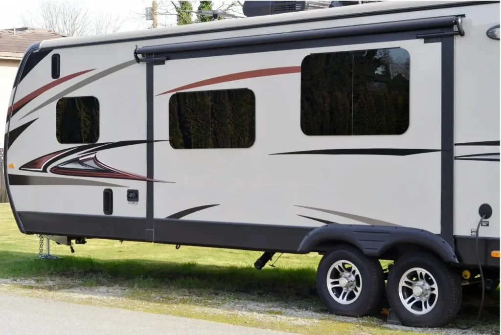 A Dutchman travel trailer parked in a grassy lot is our best-in-class choice for simplicity.