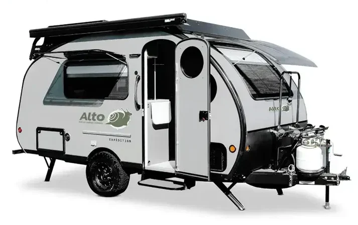 The product image of a light grey Safari Condo, with its unique front window and doors open, demonstrates why it is considered the most innovative travel trailer.